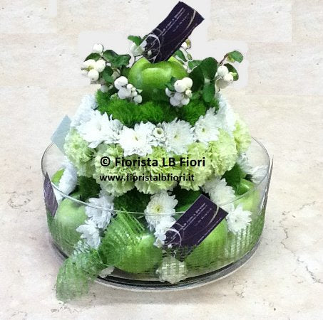 Composition of flowers and seasonal fruit